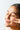 Woman rubs coconut oil into skin